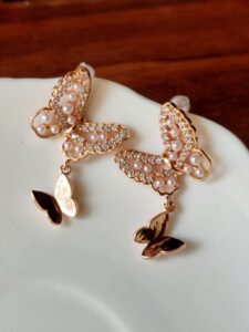 Thea's Rose-Gold Butterfly Drop Earrings