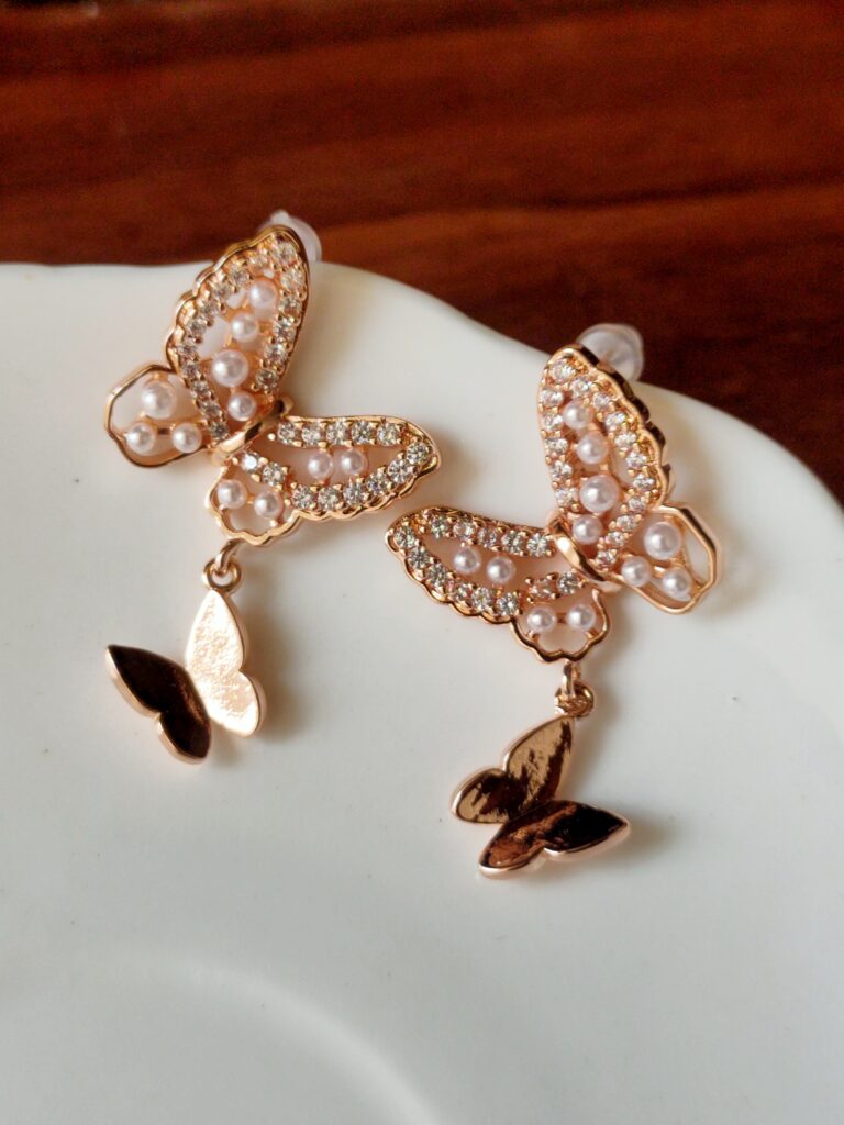 Thea's Rose-Gold Butterfly Drop Earrings