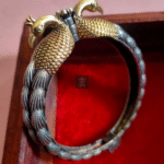 Thea's Silver Look-Alike Peacock Shaped Screw Bangle - view 1